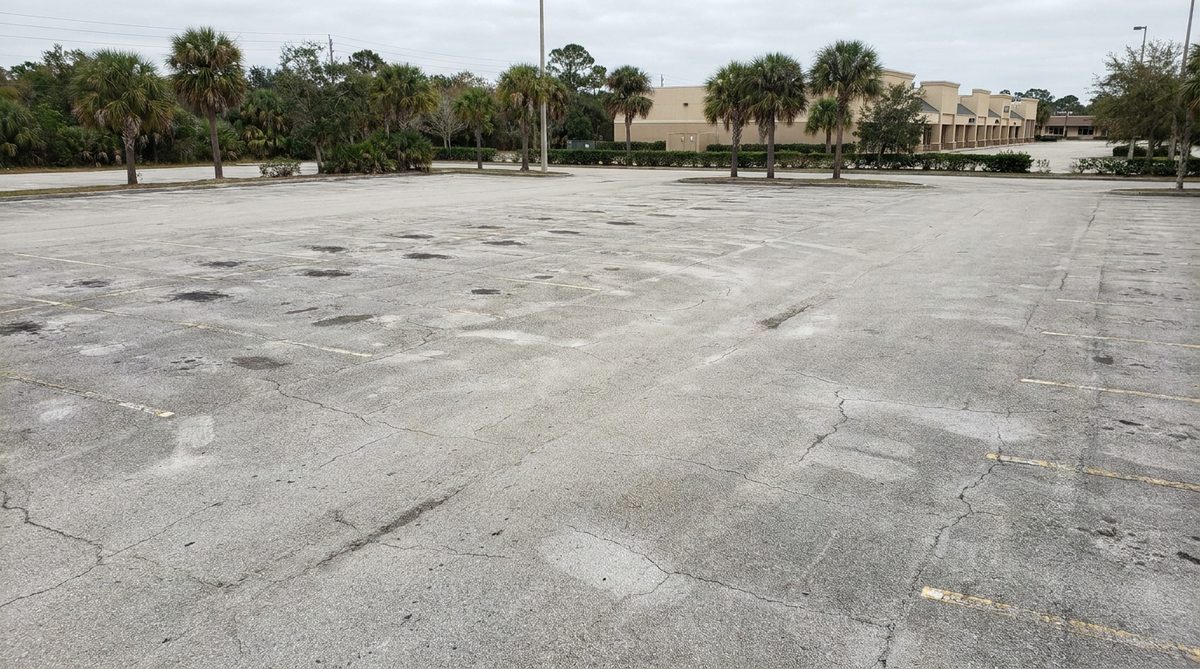 Parking lot with faded striping